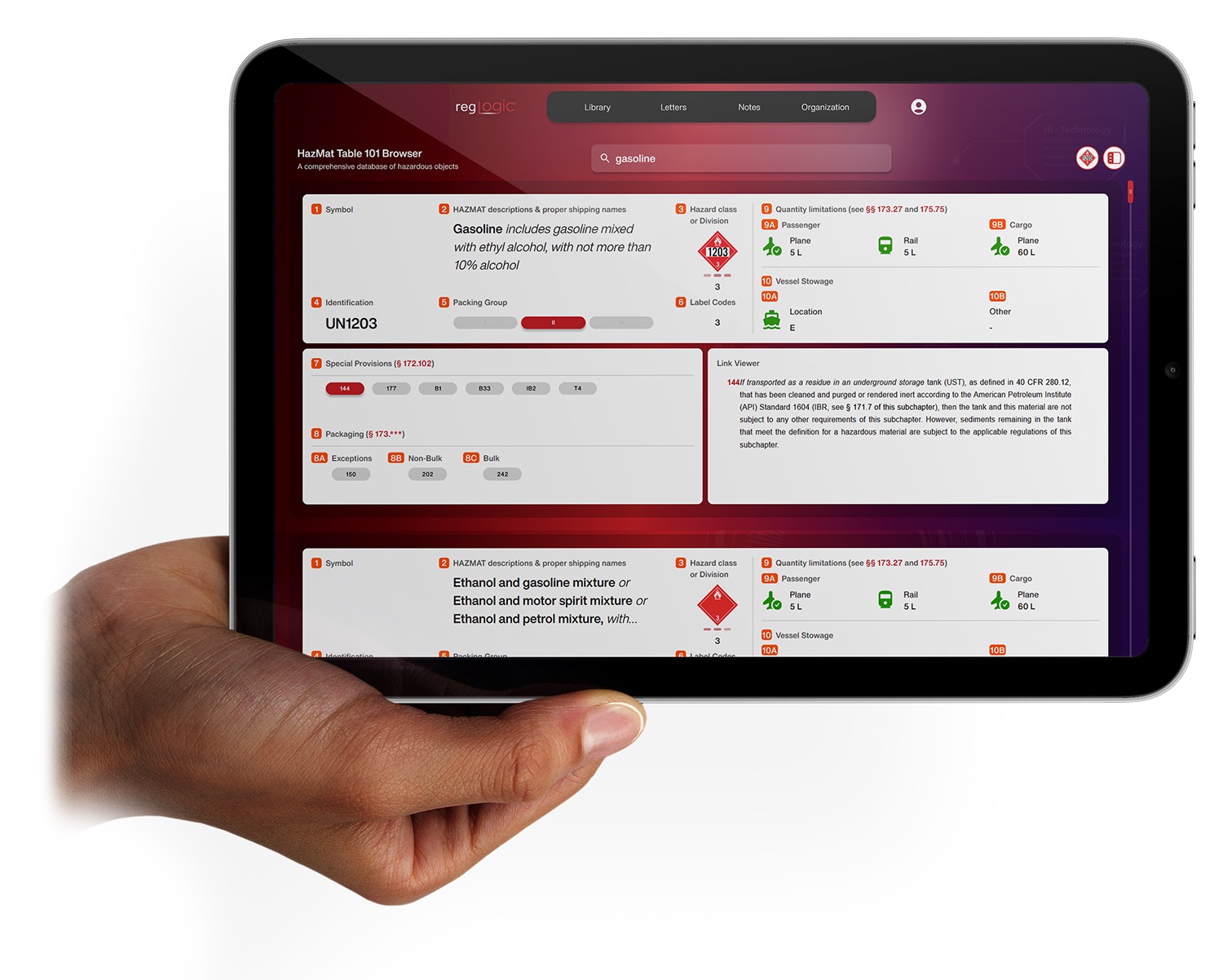 Hand holding tablet displaying RegLogic application on a manufacturing floor